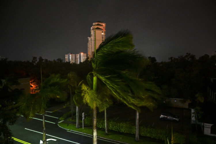 Wind blows as Hurricane Milton makes landfall in Fort Myers, Florida on October 9, 2024. Milton made landfall in Florida October 9, 2024 as an "extremely dangerous" Category 3 hurricane, packing life-threatening storm surge, extreme winds and flash flooding, the National Hurricane Center (NHC) said. "Data indicate the eye of Hurricane Milton has made landfall near Siesta Key in Sarasota County along the west coast of Florida," the NHC said in an 8:30 pm (0030 GMT Thursday) bulletin. (Photo by CHANDAN KHANNA / AFP)