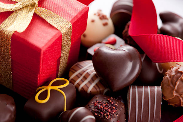 Chocolate Candies and Gift Box. Selective Focus.